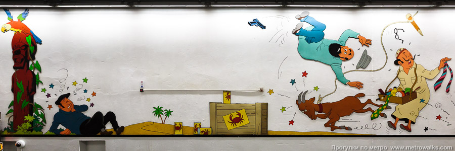 Станция Stockel / Stokkel [Стоке́ль] (линия 1, Брюссель). Путевые стены станции украшены иллюстрациями комиксов «Приключения Тинтина» бельгийского художника Эрже.